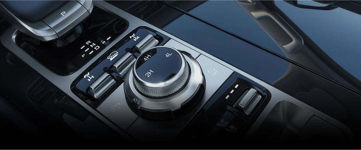 When one side’s drive wheel slips, the three locks can transfer engine torque to the other side’s drive wheel, helping the vehicle to get out of a tough situation. / The Creep mode function developed for driving in challenging terrains. / Smooth Switching between 2H, 4H, and 4L.