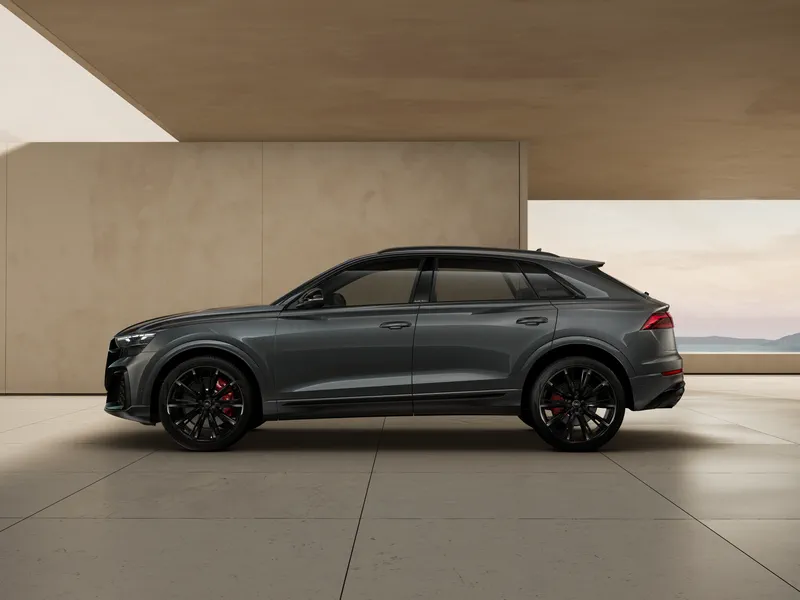 The available Black optic package features 22` 10-spoke Y-design wheels in metallic black. Anthracite gray Audi rings, black exterior trim, and black exhaust tips complete the look. Wheel shown is the optional 23` multi-spoke design in bicolor finish.