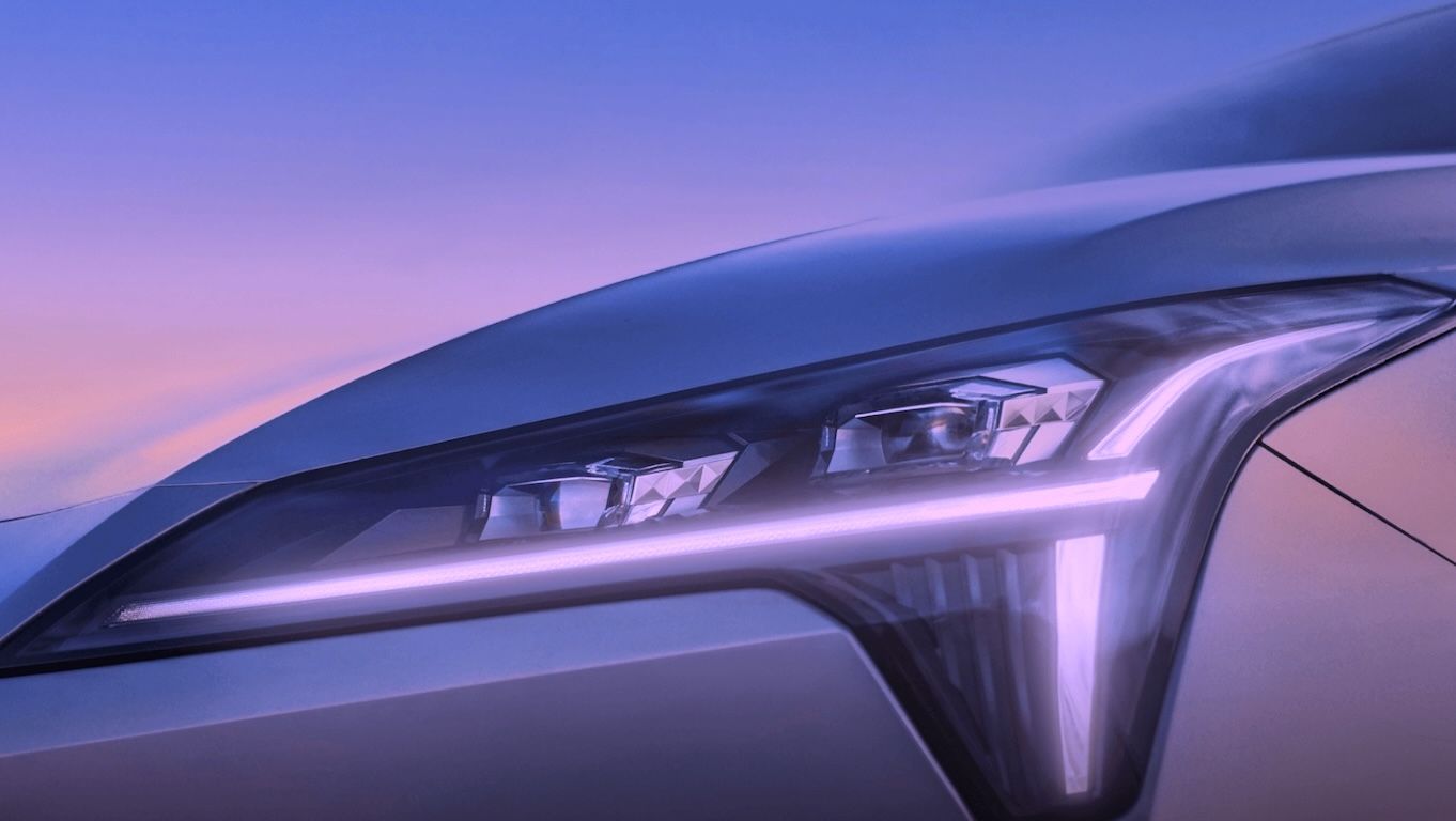A closed front face with a coupe design, starship-style headlights, and a connected tail light for full-tech appeal.